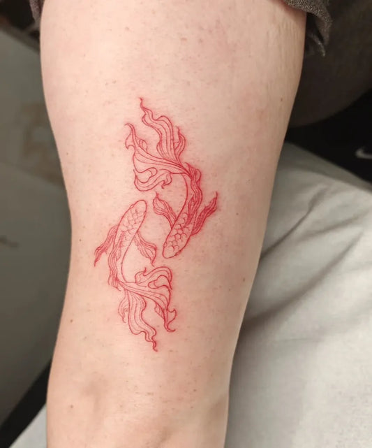 Small Red Two Koi Fish Tattoo on Women Arm by @sacredtree_ink
