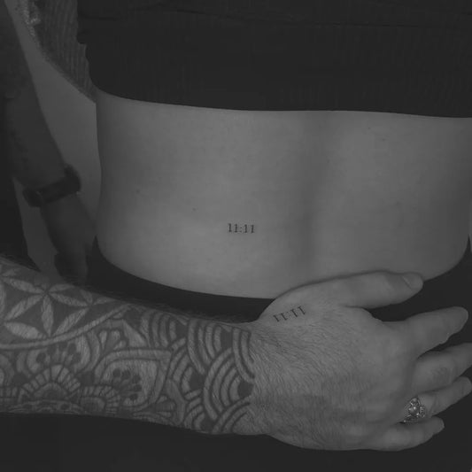 Small Roman Numerals on Couple Back Matching Tattoo by @la_ta_ttuu