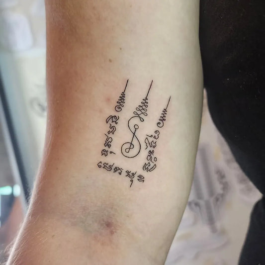 Small Sak Yant Hah Taew Sak Yant Tattoo on Men Arm by @nomoreinktattoo