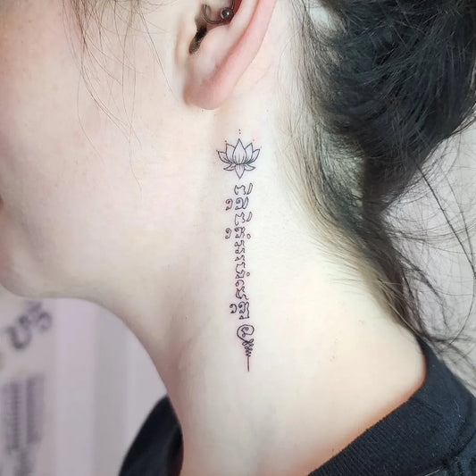 Small Sak Yant Lotus Script Tattoo on Women Neck by @nomoreinktattoo