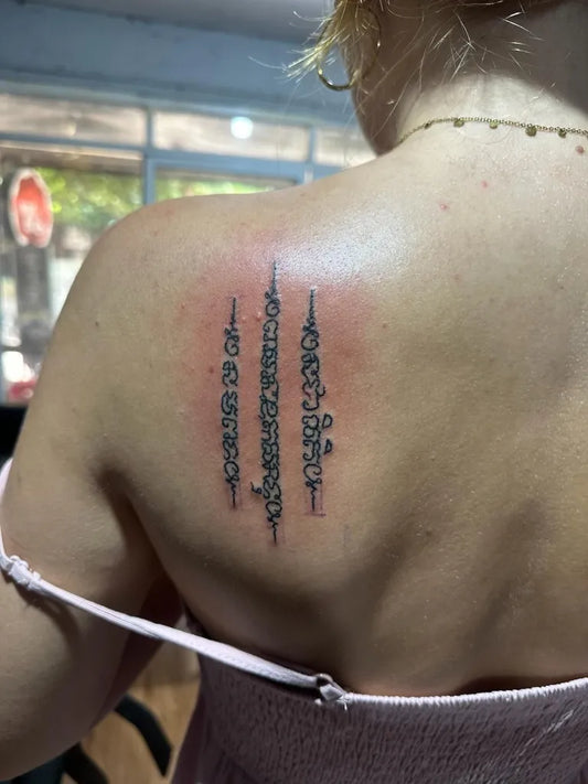 Small Sak Yant Sak Yant Script Tattoo on Women Shoulder by @preservation_khmer_sakyant