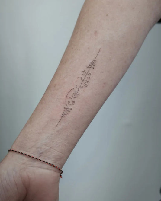 Small Sak Yant Script and Flowers Tattoo on Women Forearm by @takeitexxy