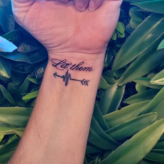 Small Script Let Them Arrow Heartbeat on Men Wrist Tattoo by @samink_405
