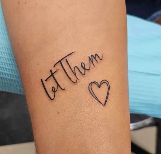 Small Script Let Them Heart on Women Arm Tattoo by @13smash_ink13