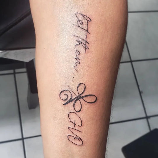Small Script Let Them and Clover on Women Arm Tattoo by @miki_tattoos