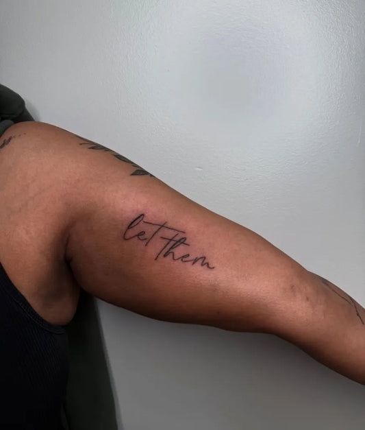 Small Script Let Them on Women Arm Tattoo by @444.inkandbeauty
