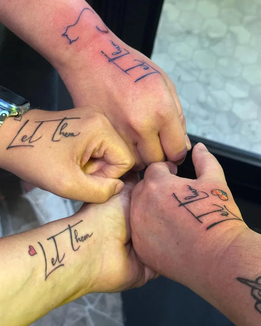 Small Script Let Them on Women Hands Tattoo by @amy.schroeder93