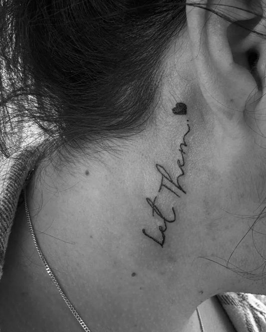 Small Script Let Them on Women Neck Tattoo by @tel_sharp_tattoos