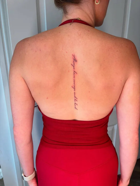Small Script Phrase on Women Spine Tattoo by @hallettink_