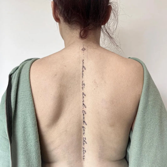 Small Script Quote on Women Spine Tattoo by @daughters_skin