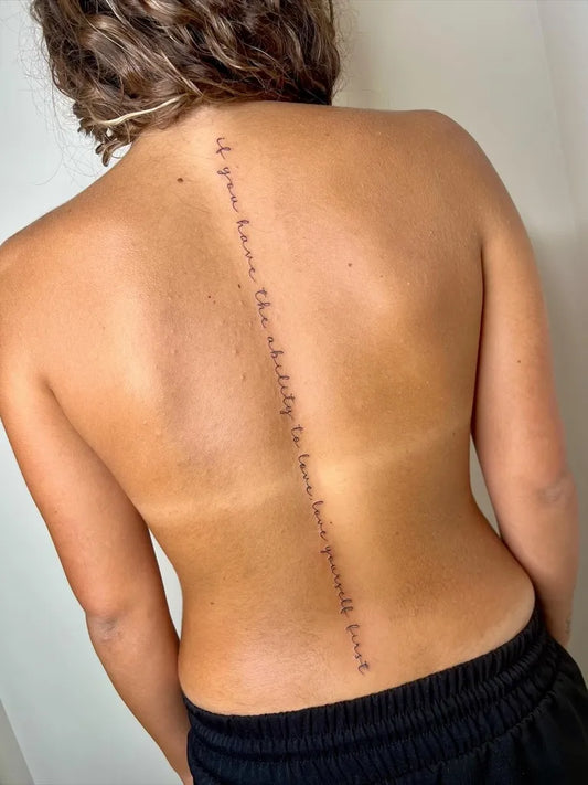 Small Script Quote on Women Spine Tattoo by @vale_tattoo_artist
