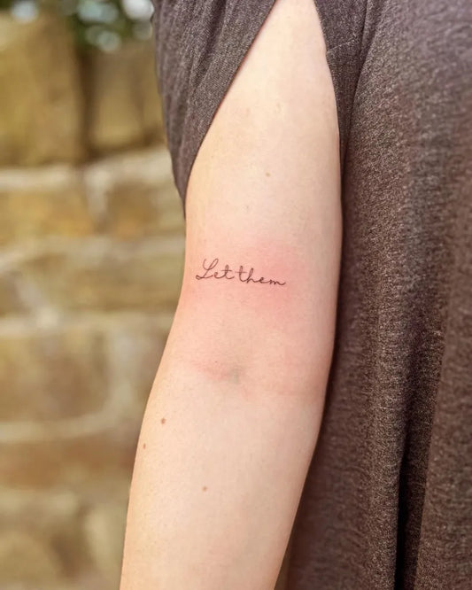Small Script Text Let Them on Women Arm Tattoo by @baddietattoos_bt