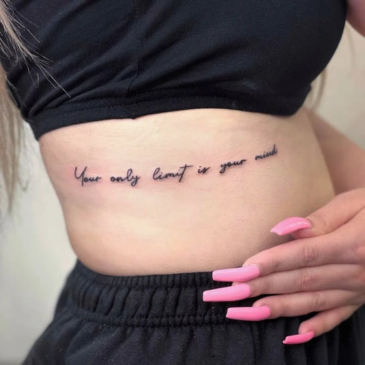 Small Script Your Only Limit Is Your Mind Quote Tattoo on Women Side by @undergroundtattoos_enfield