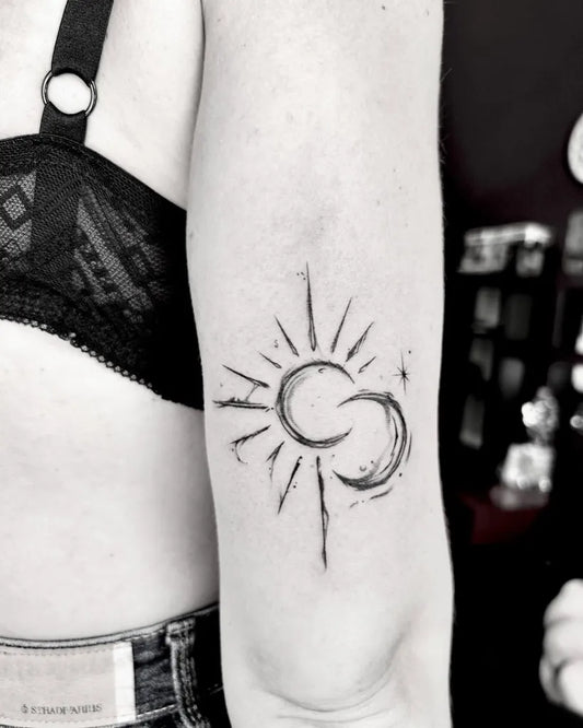 Small Sketch Sun and Moon on Women Arm Tattoo by @martinariccitattoo