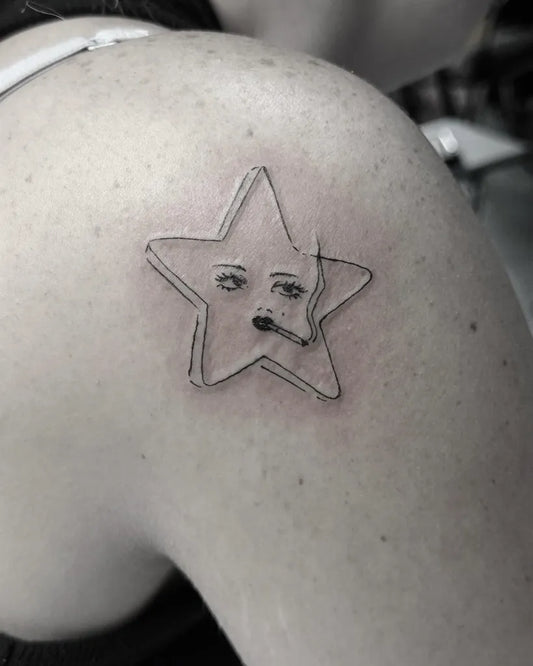 Small Smoking Star with Eyes and Cigarette Tattoo on Women Shoulder by @girlnextdoortattoo