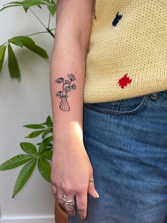 Small Stick and Poke Flower Bouquet in Vase Tattoo on Women Forearm by @jacofsometrades