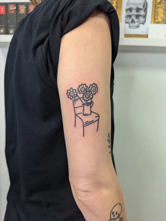 Small Stick and Poke Flowers in Vase on Chair Tattoo on Women Arm by @starttodaytattoo