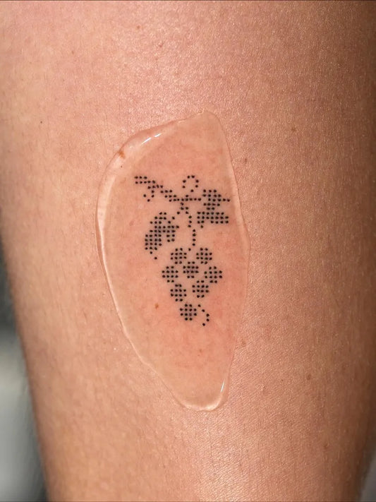 Small Stick and Poke Grape Cluster Tattoo on Women Forearm by @kimlove._.v