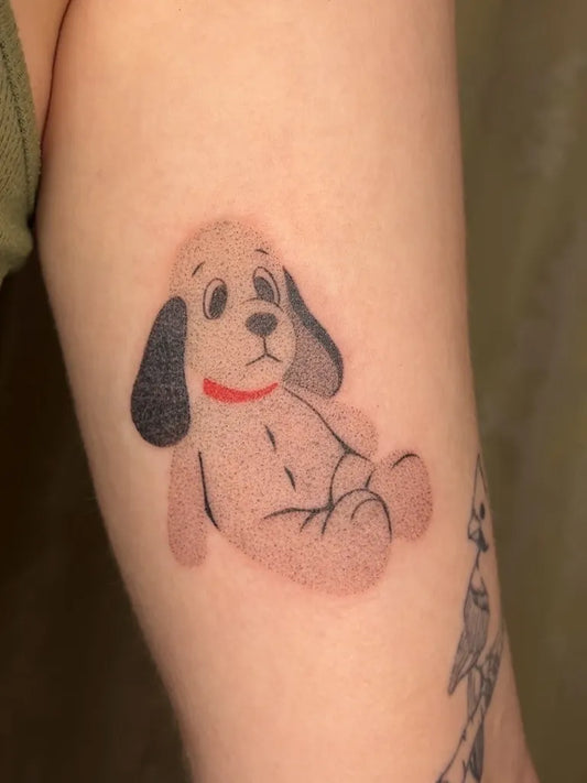 Small Stick and Poke Sitting Dog Tattoo on Women Arm by @softtissuetattoo