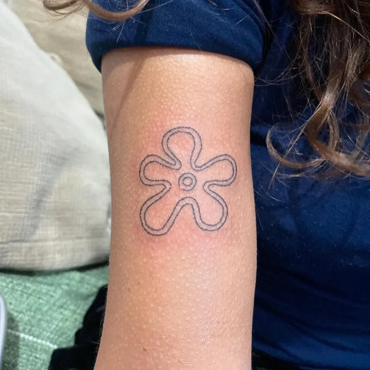 Small Stick and Poke SpongeBob Flower Tattoo on Women Arm by @princesasonolentq2