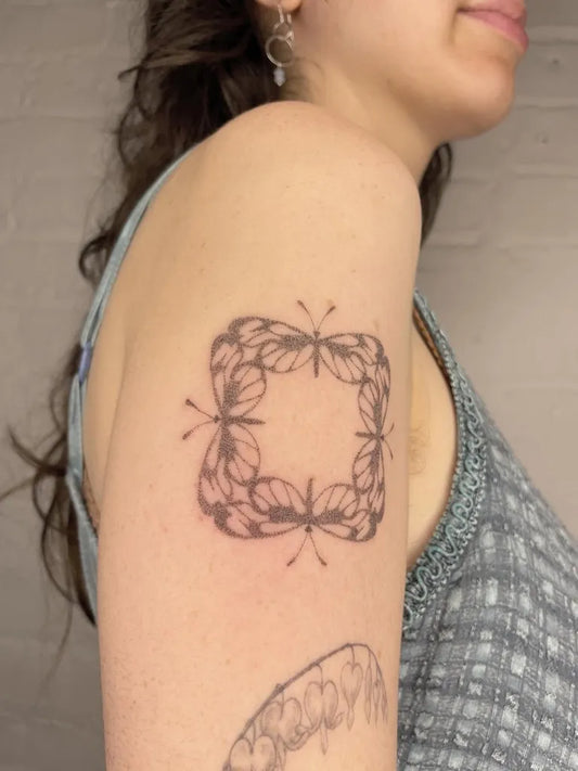 Small Stick and Poke Square Floral Frame Tattoo on Women Shoulder by @oopsiedaisy.tattoo