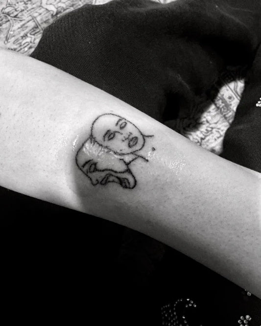 Small Stick and Poke Two Theater Masks Tattoo on Women Forearm by @lavsarax