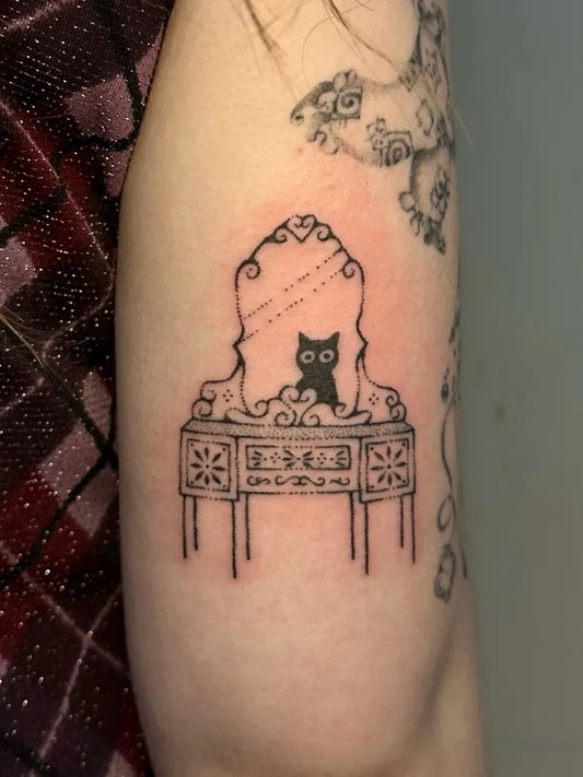 Small Stick and Poke Vanity Mirror with Cat Tattoo on Women Arm by @clara.tats