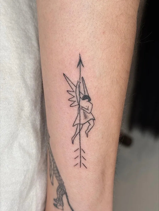 Small Stick and Poke Winged Figure Arrow Tattoo on Women Arm by @yarik.taboo