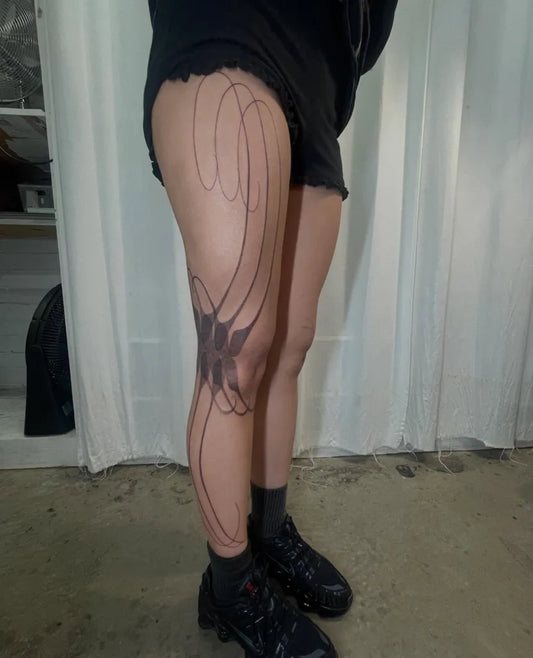 Small Swirling Flowers on Women Leg Tattoo by @locke.jaw.maria