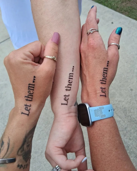 Small Text Let Them on Women Hand Tattoo by @tatted_mommaof5