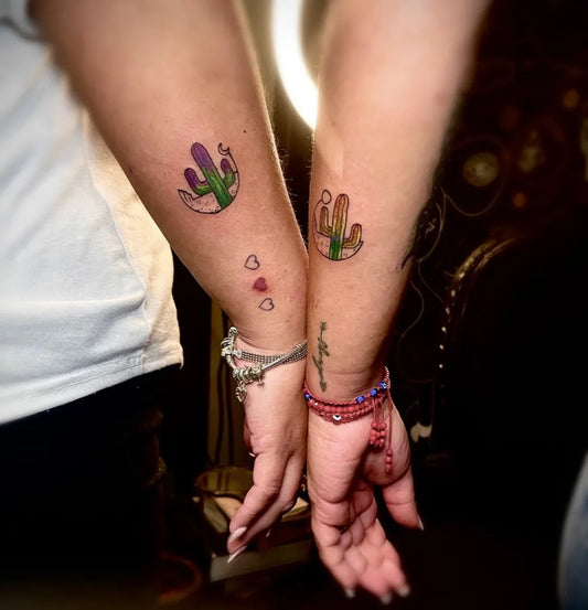 Small Traditional Cactus Crown Tattoo on Women Arm by @taturdia