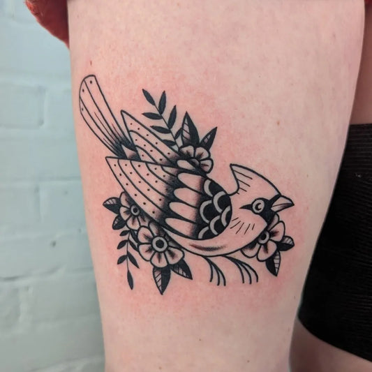 Small Traditional Cardinal and Flowers Tattoo on Women Thigh by @lozzadraws