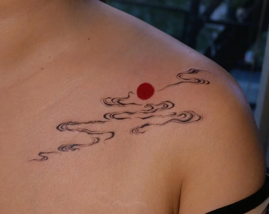 Small Traditional Cloud and Sun Tattoo on Women Shoulder by @jessieke_