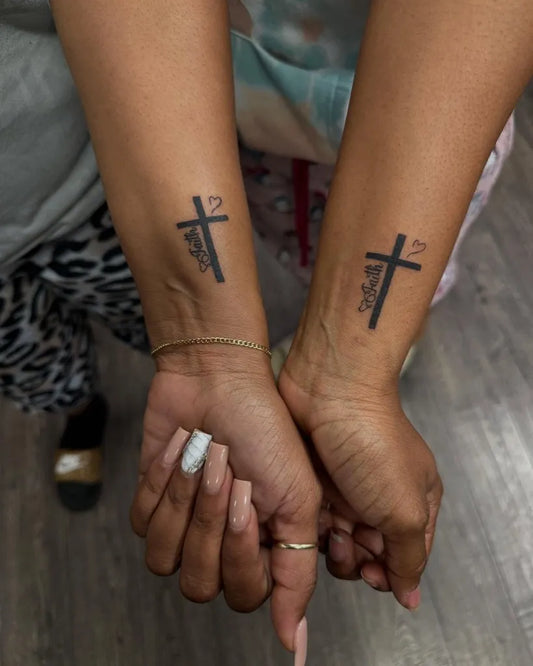 Small Traditional Cross and Love on Women Forearm Tattoo by @frenchystattoos