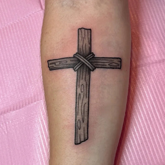 Small Traditional Cross with Rope on Women Arm Tattoo by @annie_tattoos