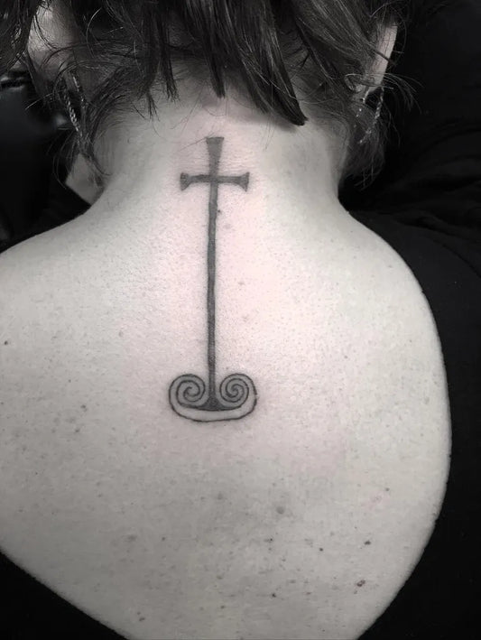 Small Traditional Cross with Spirals on Women Back Tattoo by @sloweace