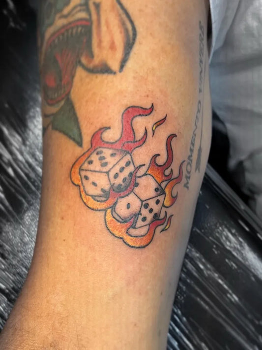 Small Traditional Dice and Flames Tattoo on Men Arm by @ash.tattz