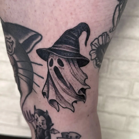Small Traditional Ghost Witch Hat Tattoo on Women Thigh by @evolmaliatat