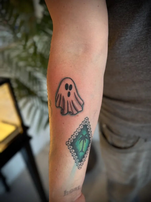 Small Traditional Ghost and Palm Tree Tattoo on Men Arm by @montauktattoony