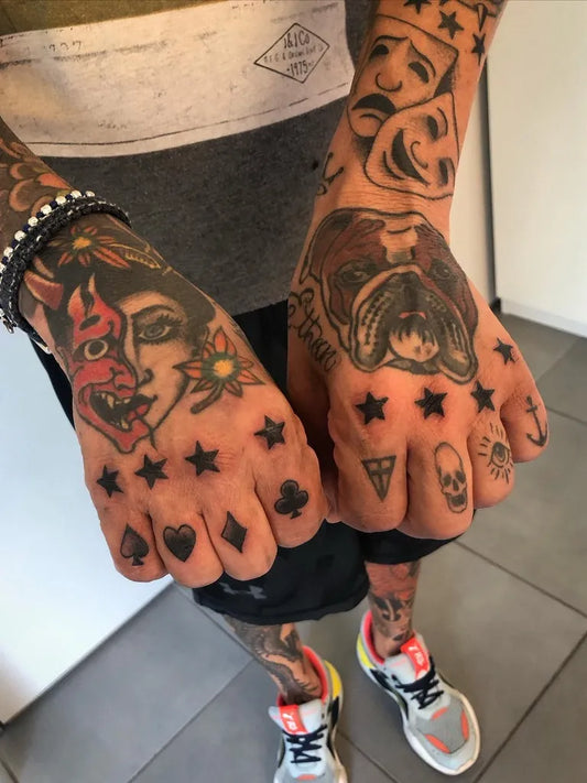 Small Traditional Hannya Mask and Bulldog on Men Hands Tattoo by @carlotiberti_tattooer_