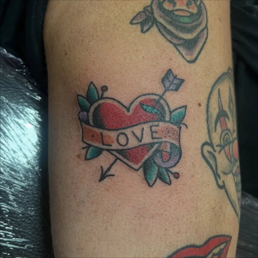 Small Traditional Heart Banner Arrow on Men Arm Tattoo by @rickertdeprikkert