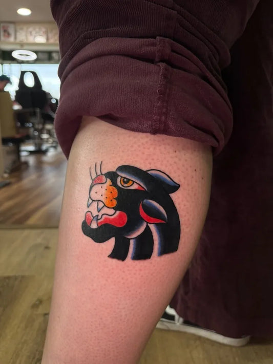 Small Traditional Panther Tattoo on Men Arm by @mobunniemoproblems