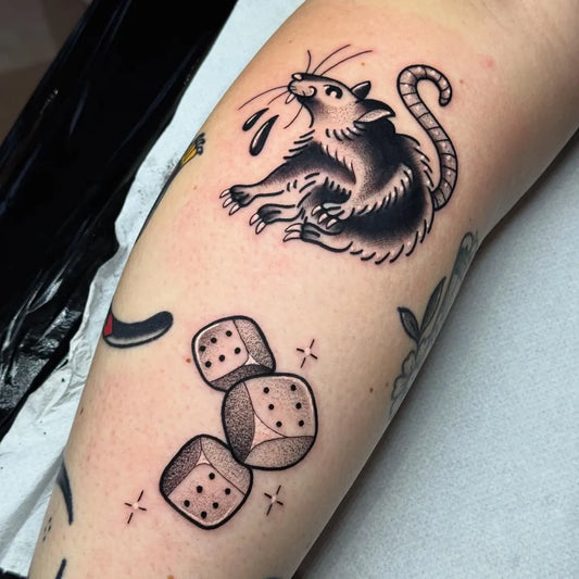 Small Traditional Rat and Dice Tattoo on Women Arm by @marieradfordtattoo