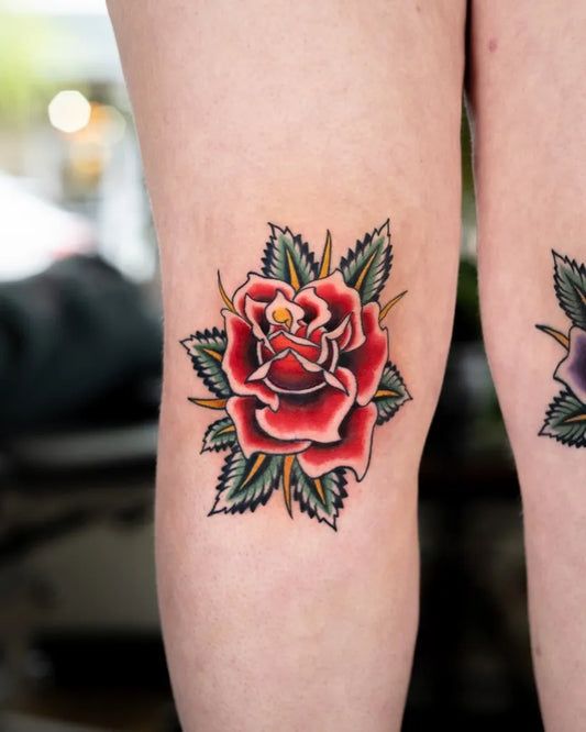 Small Traditional Red Rose on Women Knee Tattoo by @hopelesstattoo