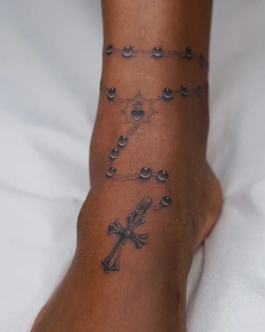 Small Traditional Rosary Cross on Women Ankle Tattoo by @chnaw_tattoo