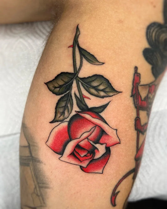 Small Traditional Rose on Men Upper Arm Tattoo by @fabio_nembo_