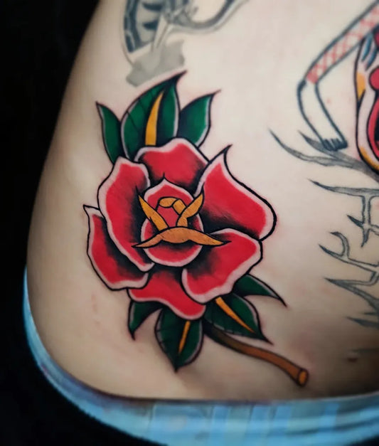 Small Traditional Rose on Women Hip Tattoo by @karina_galavie