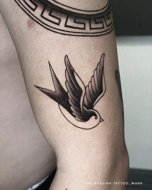 Small Traditional Sparrow Tattoo on Men Arm by @thebossink.tattoo