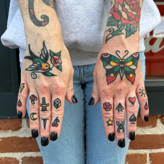 Small Traditional Swallow Rose Butterfly Tattoo on Women Hands by @davelurks