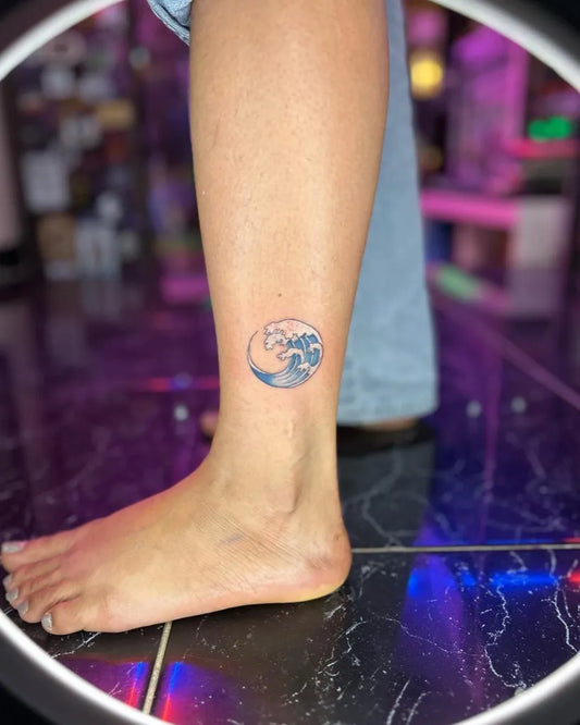 Small Traditional Wave Moon Tattoo on Women Ankle by @yanninkstattoo